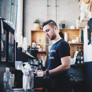 A barista at the counter